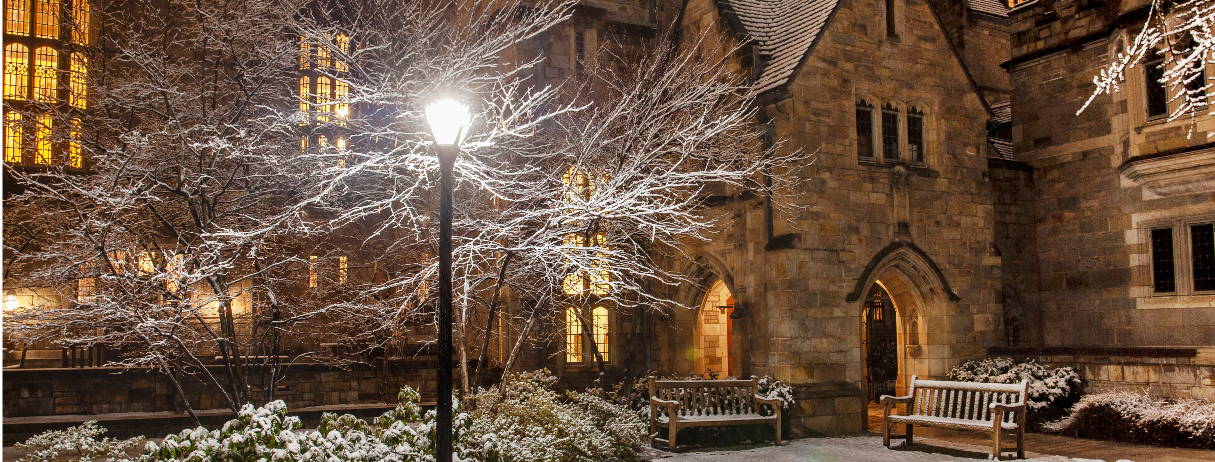 Yale building on a winter evening with snow 