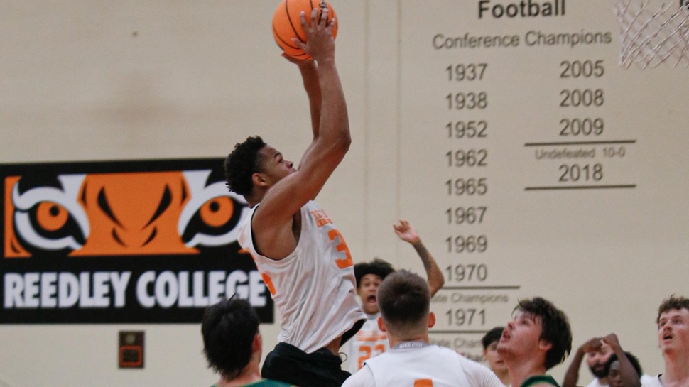 Tigers Basketball player attempting a jumpshot 