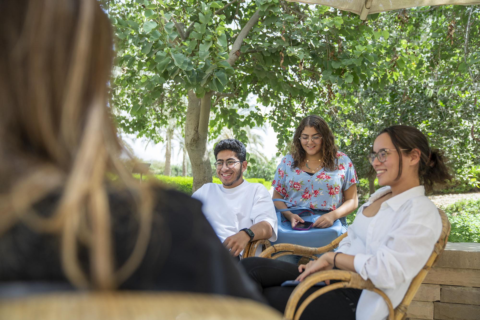 Students socializing in the garden area